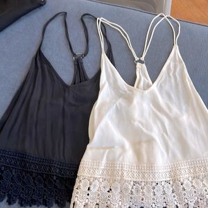 ecote size small racer back tanks in black and off white